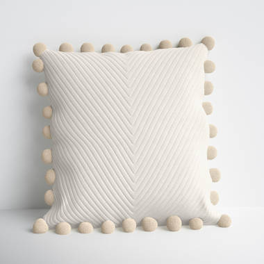 Cream throw discount with pom poms